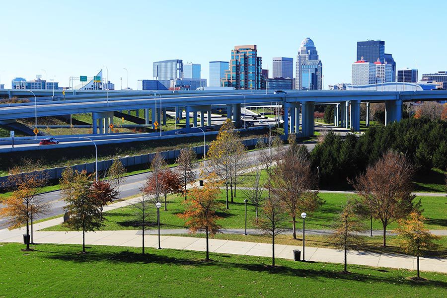 Contact - Aerial View of Louisville, Kentucky Skyline With the Expressway in Front on a Sunny Day